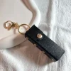 Bosanova Charms | Porte-clés étui à rouge à lèvres noir